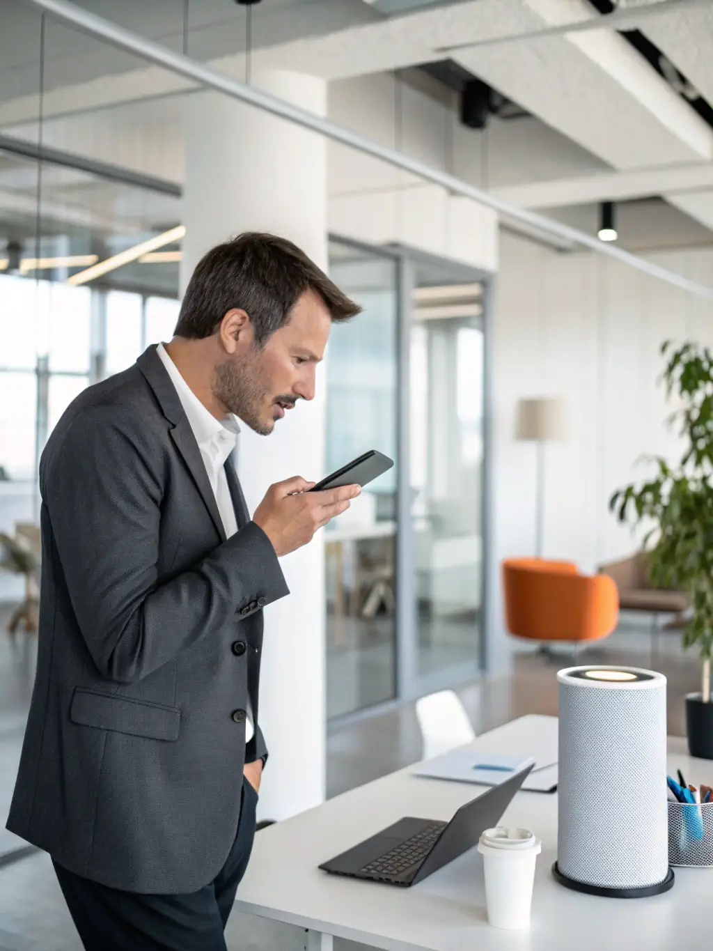 A professional using a voice assistant on a smartphone to schedule a meeting, showcasing the convenience of voice-activated commands.